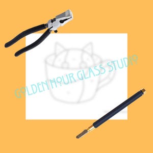 May include: Image features two tools for glass work. One is a pair of black-handled pliers with a silver head. The other is a dark blue handled glass cutter with a gold-colored tip. The background is a light orange color with the text "GOLDEN HOUR GLASS STUDIO".