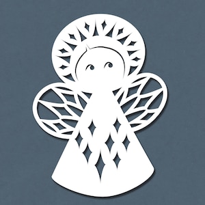 May include: White paper cut-out of an angel with a halo, wings, and a star-shaped pattern.