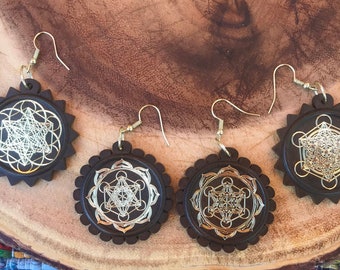 copper and laser-cut wooden sacred geometry pendant earrings in resin | geometric design: Metatron's Cube, Seed of Life, Flower of Life+more