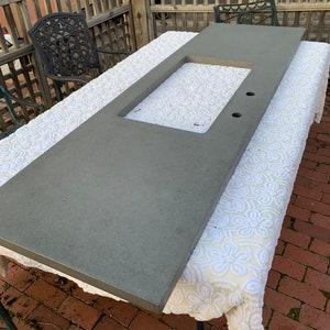 Cement Counter Top brand new never installed, approximately 85” x 26” hole cut for new stainless steel sink at Menards see shipping info