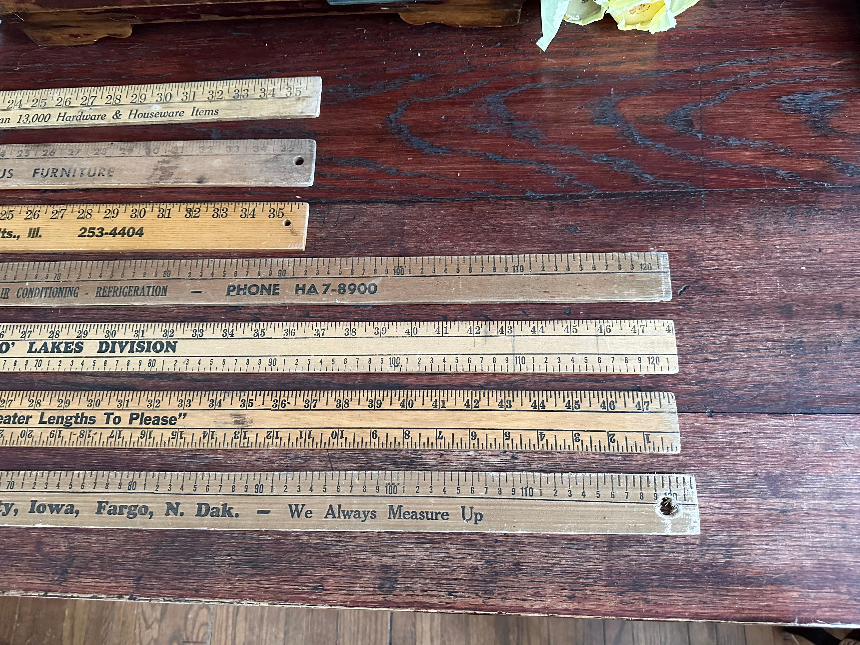 Group Of Advertising Yard Sticks Auction