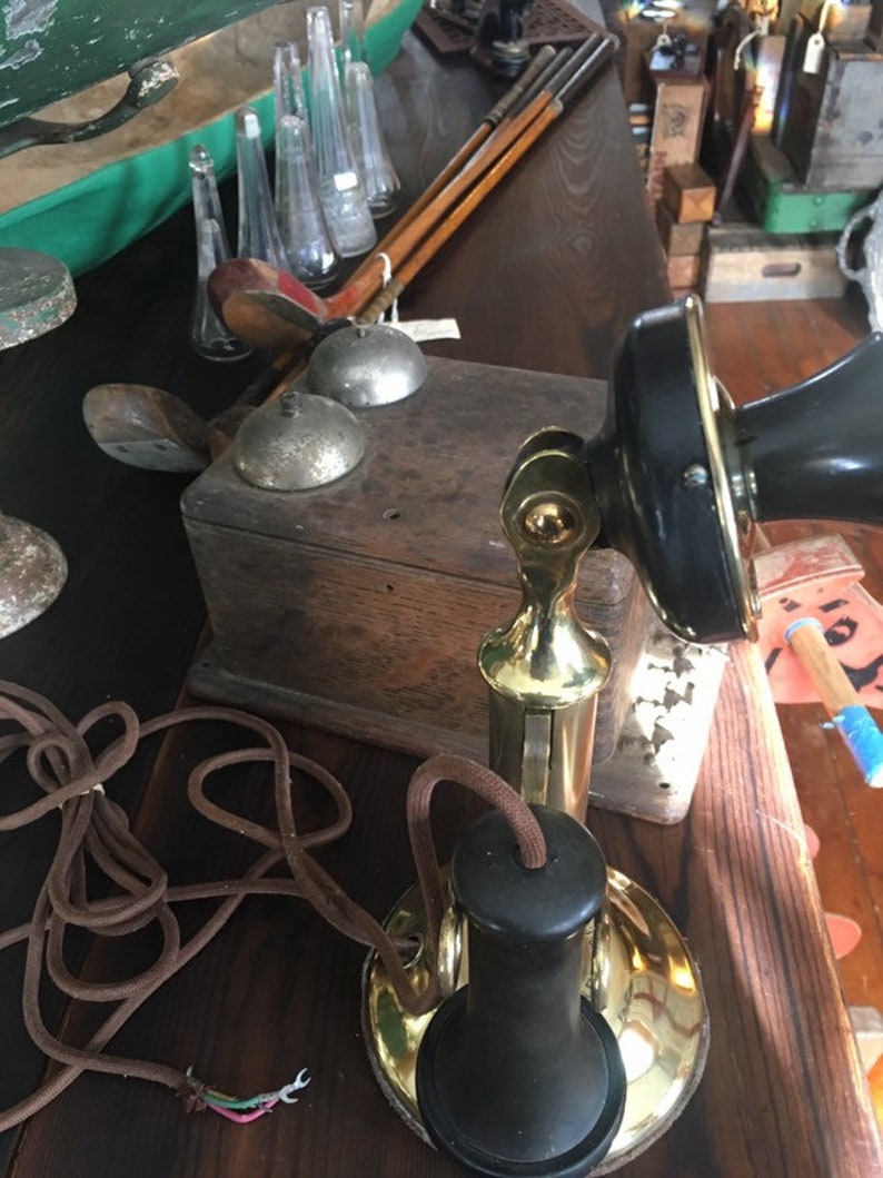 1904 With Ringer Box Here is an original Antique Brass American Telephone and Telegraph Candlestick Original Telephone