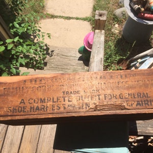 May include: A wooden box with the text "A Complete Outfit For General Shoe, Harness and Gin Repairing." The box is weathered and has a brown stain.