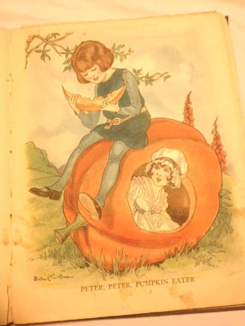 May include: An illustration of two children sitting inside a large orange pumpkin. The child on the left is wearing a blue dress and holding a slice of pumpkin. The child on the right is wearing a white dress and has their hair pulled back. The text "PETER, PETER, PUMPKIN EATER" is written below the pumpkin.