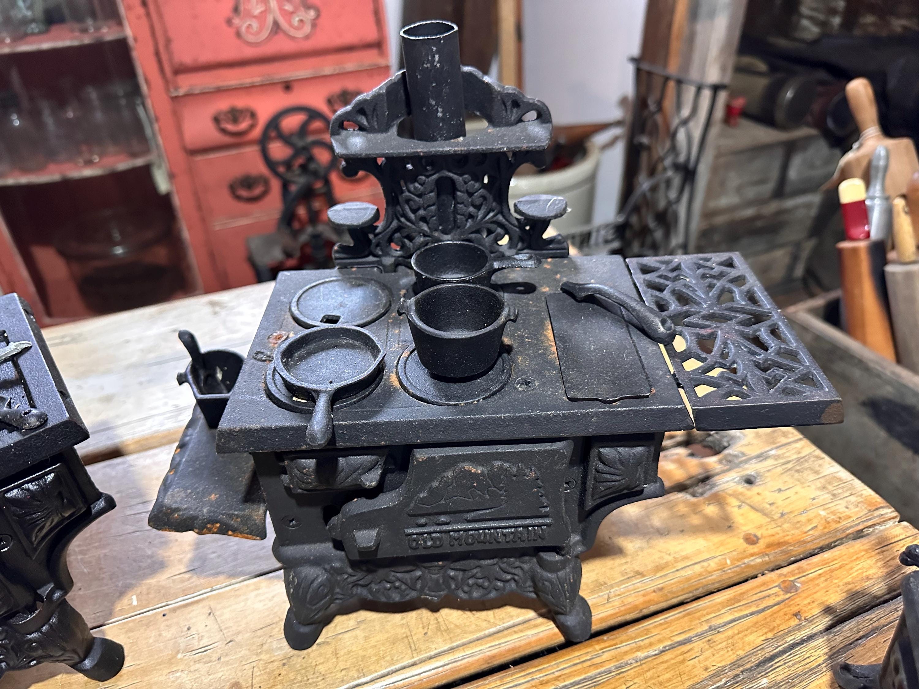 Four Antique Small Cast Iron Old Mountain Stoves, Largest is