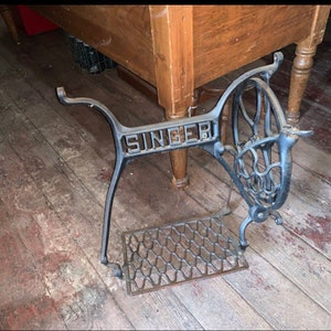 Antique Singer Mfg Co. Sewing Machine Cast Iron mid section of Base only, includes treadle peddle wheel and gaurd