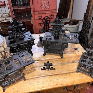 Four Antique Small Cast Iron Old Mountain Stoves, Largest is