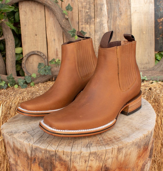 Precio de botines para hombre sales