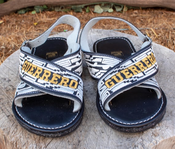 blue huaraches with gold strap