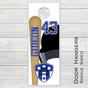 May include: Door hanger with a baseball bat design. The bat is tan with the name "GIDEON" in blue. The number "43" is in blue with a white outline. A blue and white shield with stars and the text "ADD YOUR LOGO" is at the bottom. The text "DOOR HANGERS SINGLE SIDED" is on the right.