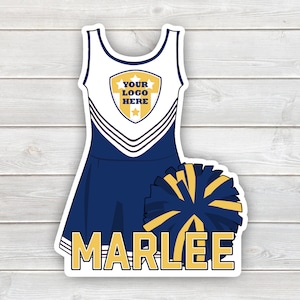 May include: A white and blue cheerleading uniform with a gold shield that says "YOUR LOGO HERE". A blue and gold pom-pom is below the uniform. The name "MARLEE" is written in gold letters below the pom-pom.