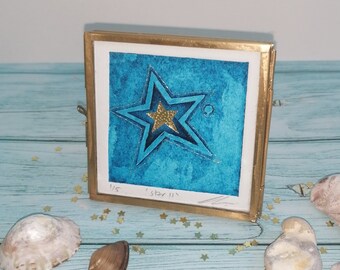 Star II, small framed original blue collagraph print with gold embellishments