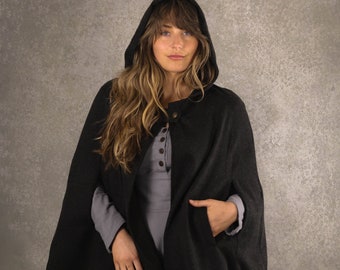 May include: A black hooded cloak with a Celtic knot design on the front. The cloak is made of wool and has a long, flowing style.