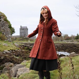 Discover our Rusty Red Midi Wool Coat for woman. Upgrade your wardrobe with this felted Wool midi Coat in a timeless style.