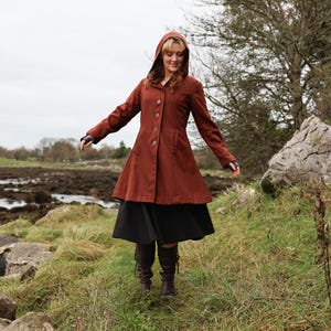 Discover our Rusty Red Midi Wool Coat for woman. Upgrade your wardrobe with this felted Wool midi Coat in a timeless style.
