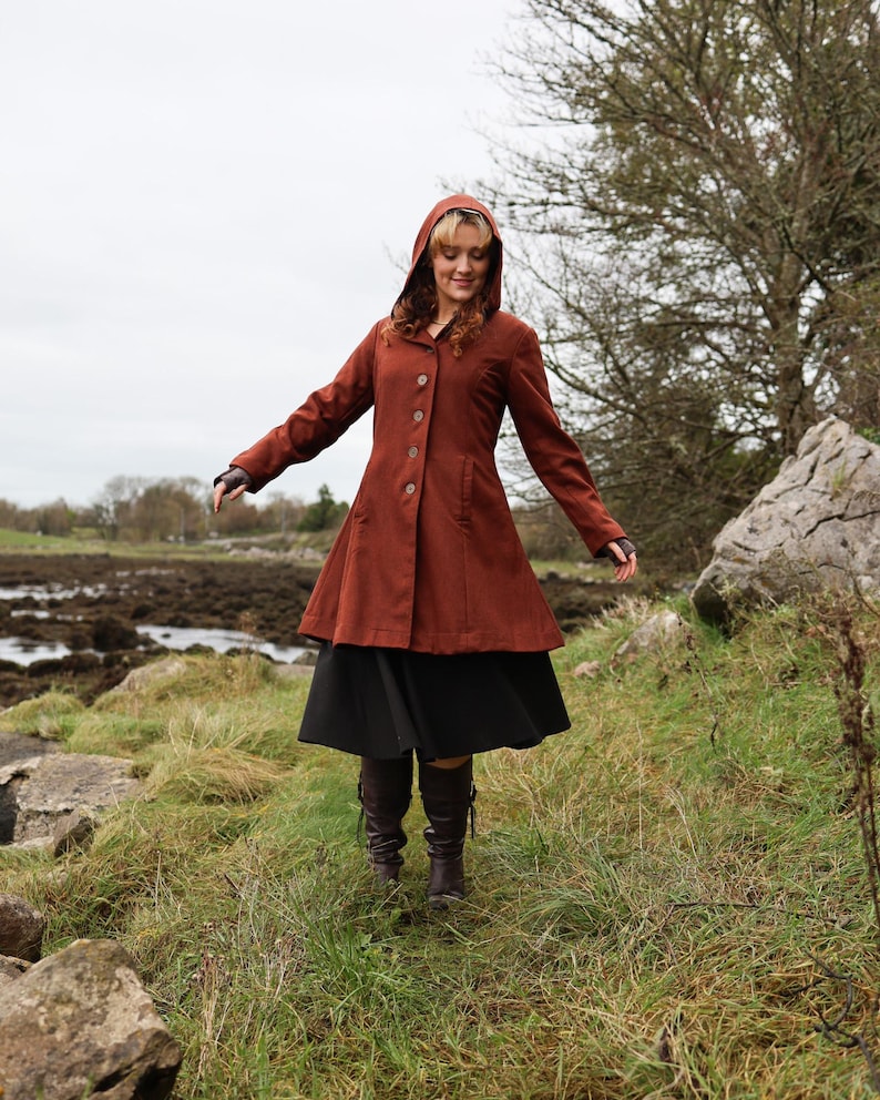 Discover our Rusty Red Midi Wool Coat for woman. Upgrade your wardrobe with this felted Wool midi Coat in a timeless style.