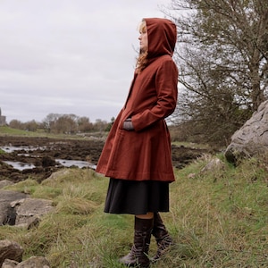 Discover our Rusty Red Midi Wool Coat for woman. Upgrade your wardrobe with this felted Wool midi Coat in a timeless style.