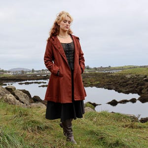 Discover our Rusty Red Midi Wool Coat for woman. Upgrade your wardrobe with this felted Wool midi Coat in a timeless style.