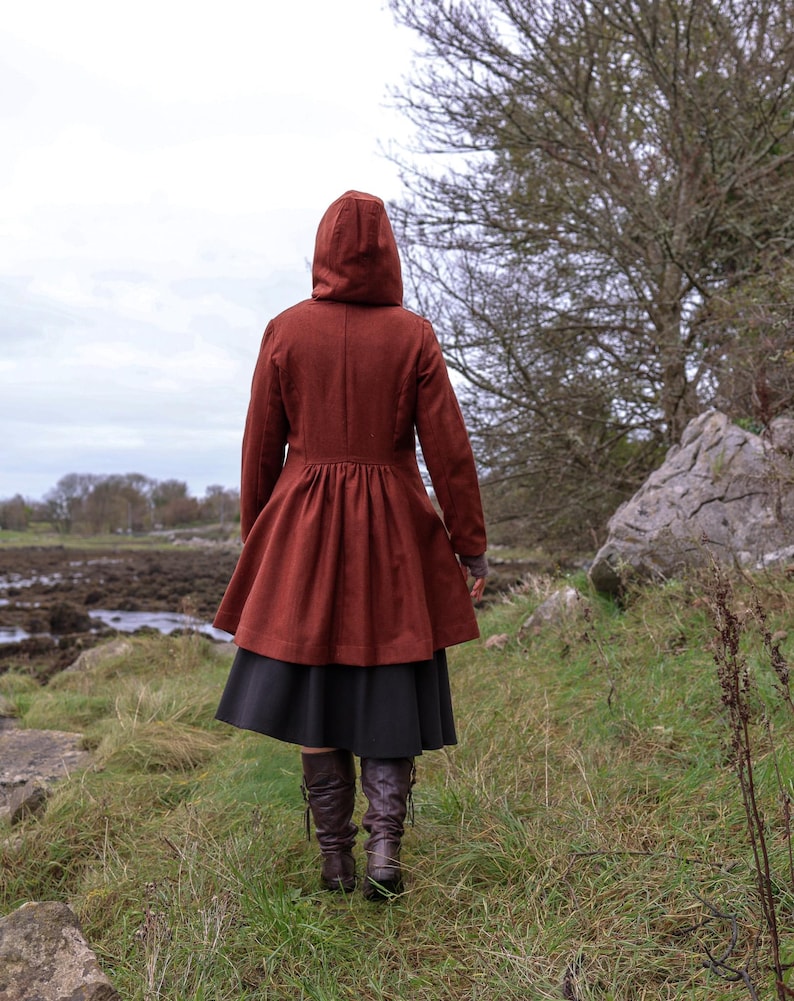 Discover our Rusty Red Midi Wool Coat for woman. Upgrade your wardrobe with this felted Wool midi Coat in a timeless style.