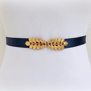 Ceinture élastique bleu marine en forme de feuilles de grecques dorées