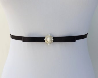 Black thin elastic pearly jeweled bow belt