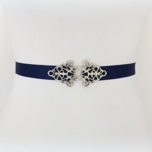 Navy blue elastic waist belt with silver filigree clasp