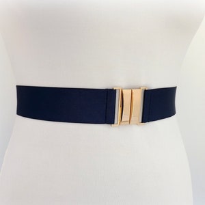Navy blue elastic waist belt with gold clasp