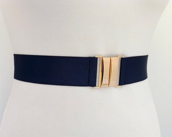 Navy blue elastic waist belt with gold clasp