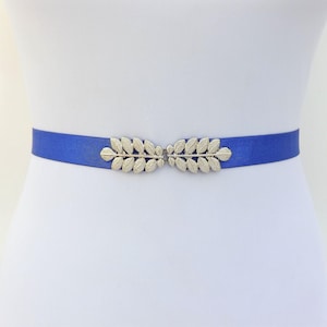 Royal blue elastic waist belt with silver grecian leaf clasp