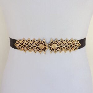 Black elastic waist belt with gold filigree clasp