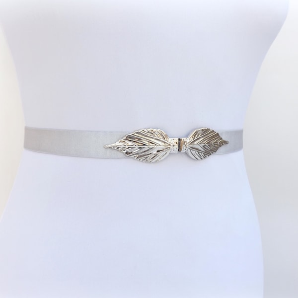 Women's silver elastic waist belt with silver leaf clasp