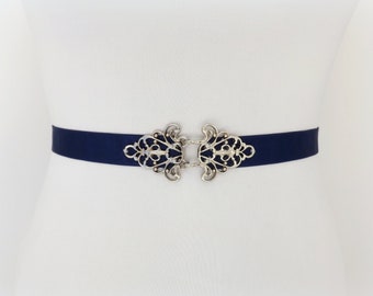 Navy blue elastic waist belt with silver filigree clasp