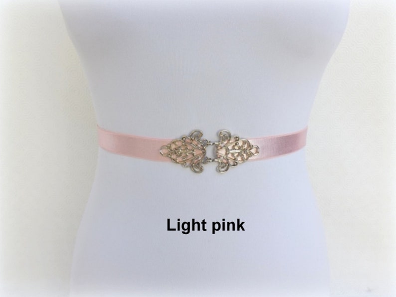 Black elastic waist belt with silver filigree clasp
