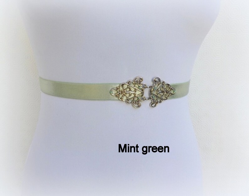 Black elastic waist belt with silver filigree clasp