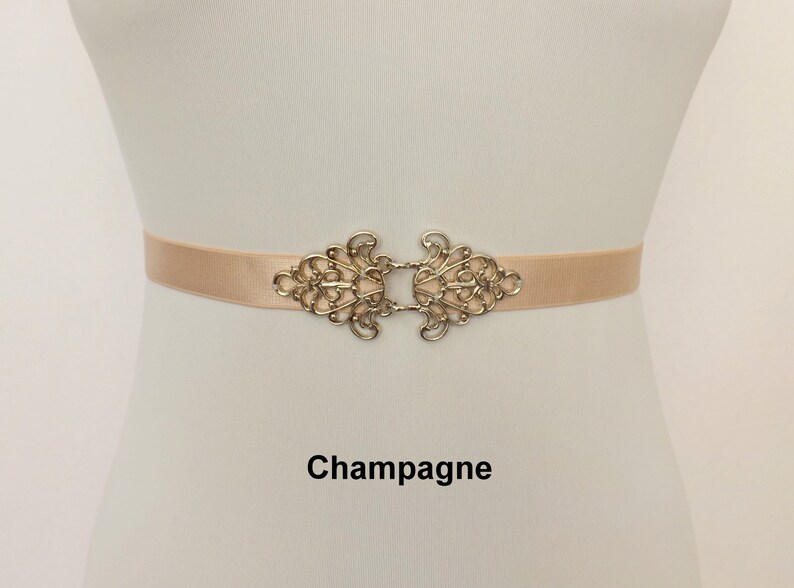 Black elastic waist belt with silver filigree clasp