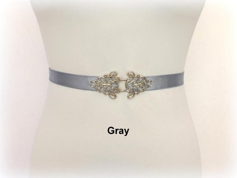 Black elastic waist belt with silver filigree clasp