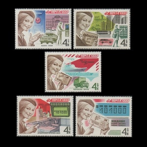 May include: Four vintage Soviet postage stamps featuring illustrations of mail delivery methods. The stamps are from 1977 and depict a woman in a red hat and a blue dress. The stamps show a woman receiving mail, a woman sorting mail, a woman delivering mail by car, and a woman delivering mail by boat. The stamps are in good condition and have a 4 kopeck denomination.