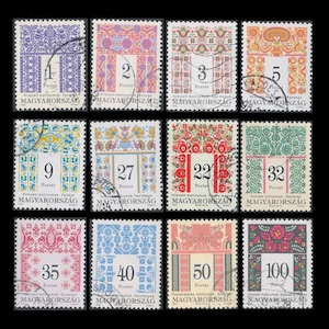 May include: A sheet of ten Hungarian postage stamps featuring colorful embroidered designs. The stamps are numbered 1, 2, 3, 5, 9, 27, 22, 32, 35, 40, 50, and 100. The stamps are all in Hungarian Forints.