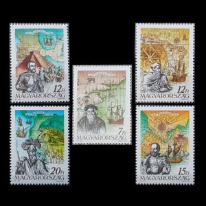 May include: Set of five vintage Hungarian postage stamps featuring illustrations of historical maps and explorers. The stamps are printed on white paper with colorful illustrations and text in Hungarian. The stamps are in good condition and have never been used.