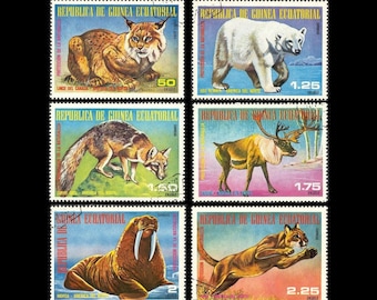 Animaux sauvages d'Amérique du Nord sur les timbres-poste de Guinée équatoriale de 1977 / Ours polaire, Lynx du Canada, Renard gris, Caribou, Morse, Puma / Art naturaliste