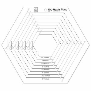 May include: A white hexagon-shaped quilting template with black lines and dashed lines. The template is labeled "You Hexie Thing" and includes measurements for finished hexagons from 1 1/2 inches to 5 inches.