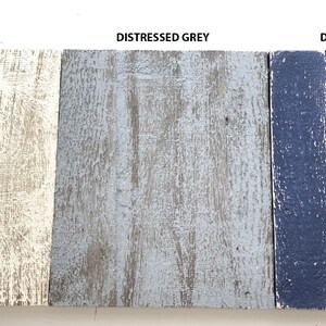May include: Three wood samples painted in distressed white, distressed grey, and distressed navy.