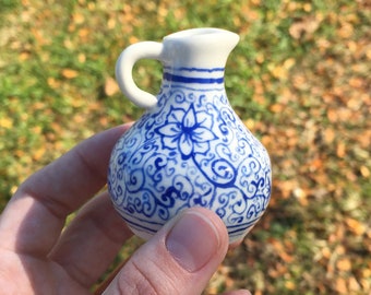Miniature painted porcelain vase