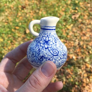 Miniature painted porcelain vase