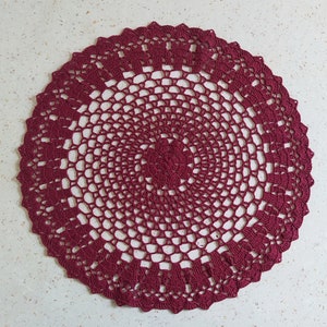 Thіs large crochet doily is made of cotton threads. Has a flat surface.  Suitable as a stand for vases, lamps, for dining, coffee and cosmetic tables. The doily perfectly complements the interior and creates comfort and style in your home.