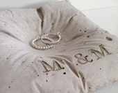 Concrete ring pillow with initials