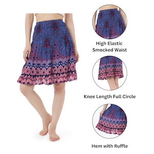 Peut inclure: Une jupe &agrave; fleurs bleu et rose, longueur genou, avec une taille smock&eacute;e &eacute;lastique haute et un ourlet &agrave; volants.