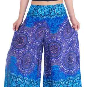 May include: Blue and purple printed palazzo pants with a floral pattern at the bottom hem.