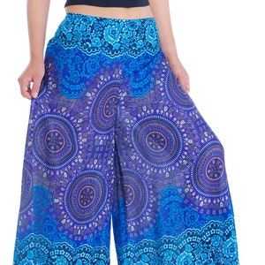 May include: Wide-leg pants with a blue and purple mandala print. The pants have a floral pattern at the bottom hem.