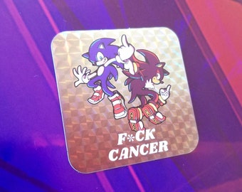 Puede incluir: Adhesivo cuadrado con acabado holográfico con dos erizos de dibujos animados. Uno es azul, el otro negro y rojo. Ambos hacen la peineta. El texto "F*CK CANCER" está impreso en blanco.